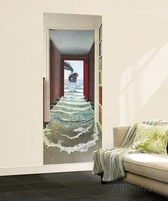 an open door leading into a living room with a painting on the wall behind it