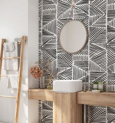 a bathroom with black and white wallpaper, a wooden ladder and a round mirror