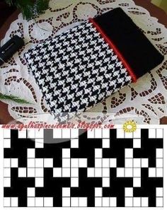 a black and white checkered cloth on a doily next to a cell phone