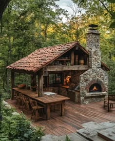 a wooden deck with an outdoor kitchen and fireplace