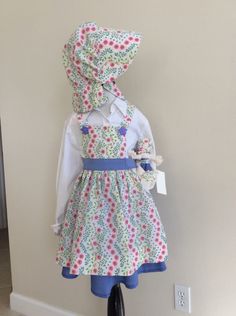 This three piece outfit comes with skirt, bonnet, and apron.  This is a size 3.  16" skirt. 13" apron. 16" waist.  Comes with matching rag doll. Outfit With Skirt, Pioneer Clothing, Girls Costumes, Bib Apron, Rag Doll, Girl Costumes, Skirt Outfits, Favorite Outfit, Apron