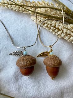 "Take a little piece of nature with you everywhere you go, with this handcrafted natural acorn necklace! Made from real acorns gathered from Toronto's beautiful High Park! Born out of a love for nature, jewellery design, and innovative thinking, I began making and selling these cuties back in 2012. After years of selling these at craft fairs & markets around the city, I am so excited to finally offer them to you at home! Years of honing my technique means that you will be gifted a quality product, and an all natural acorn pendant necklace that will last you forever!  There is absolutely no use of chemicals, dyes, or finishes on these acorns. They are completely natural and go through a very precise process of cleaning, drying, and buffing, which I have cultivated over the years. These acor Acorn Crafts, Acorn Pendant, Acorn Necklace, Jewellery Design, Metallic Accents, Blue Crystals, Necklace Silver, Make And Sell, Jewelry Plate