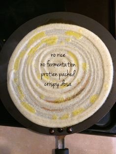 a frying pan that has some food on it with words written in the middle