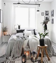 the instagram page shows an image of a bedroom with candles and pictures on the wall