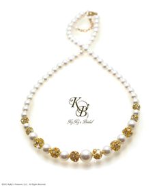 Elegant Jewelry, Timeless Keepsakes... ♥Unless otherwise stated, all of our pearl products are made with genuine Crystallized™ Swarovski pearls. You won't find cheap glass pearls here © 2016 KyKys Treasures, LLC. All Rights Reserved. This pearl necklace is an original KyKys Bridal design. ~ KyKys Bridal Boutique is a division of parent company KyKys Treasures, LLC ♥♥This gold rhinestone pearl necklace will arrive packaged and ready for gift giving in a pretty, bow-tie box. And unlike most shops, we don't charge you anything extra for this ---------------------------------------------------------------------------- ♦♦We welcome questions, but kindly ask that you read all information prior to contacting us, as most questions can be answered below:- ♦♦Please note the item Processing time that Bridal Necklace Gold, Wedding Necklace Pearl, Gold Wedding Necklace, Bridal Jewelry Pearl, Birthstone Jewelry Mothers, Jewelry Pearl Necklace, Gold Necklace Wedding, Box Bridesmaid, Gold Bridal Necklace