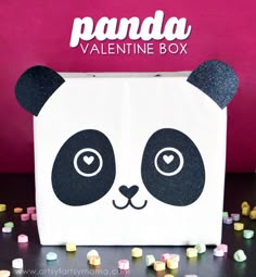 the panda valentine box is decorated with candy