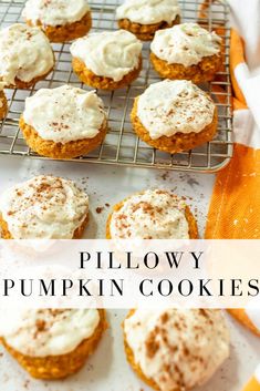 pumpkin cookies with cream cheese frosting and cinnamon sprinkles on a cooling rack