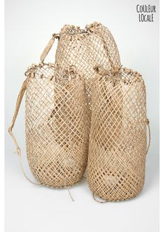 three woven bags sitting next to each other