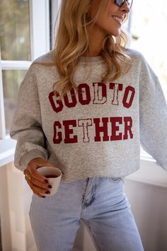 Grey long sleeve crewneck sweater that features a 'Better Together' logo in burgundy. This sweater is the perfect casual-chic wardrobe addition. Our model also wears the Grey Preston Skort and the Light Blue Maddie Jeans Sizes: S-M / M-L S-M: Length 24.02 in - Width 22.44 in M-L: Length 24.41 in - Width 23.62 in 50% cotton - 50% polyester Washing: handwash only Trendy Crew Neck Sweatshirt For Fall, Trendy Crew Sweatshirt For Fall, Trendy Fall Crew Sweatshirt, Cozy Fall Sweater For College, Cozy Fall College Sweater, Relaxed Fit Sweater For College, Fall College Sweater With Ribbed Cuffs, Long Sleeve Fall Sweater For College, Long Sleeve Sweater For College In Fall