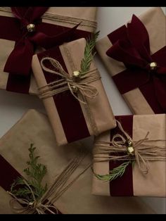 wrapped presents with ribbons and bows on them