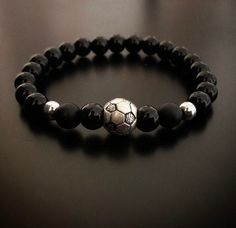 Soccer bracelet, 8mm onyx bracelet, with soccer ball charm, special gift for soccer lovers All our beads/ stones are carefully selected individually to give you the best quality Please select your wrist size and we will ensure to achieve the best fit for you.  In order to obtain superior strength, we then use silicon stretch cord.  Your bracelets will come in a black leather pouch Soccer Bracelet, Cr7 Messi, Football Lover, Ronaldo Cr7, Messi 10, Football Lovers, Onyx Bracelet, Bracelet Black, Leather Pouch