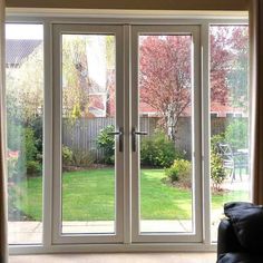 an open patio door leading to a back yard