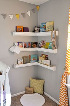 a baby's room with bookshelves and toys