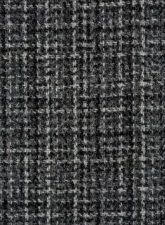 a black and white checkered fabric textured with grey flecks, closeup