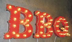 the letters b and c are lit up with lights on each side of the sign