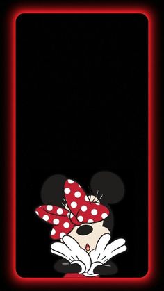 minnie mouse with polka dots on her head and red bow in front of a black background