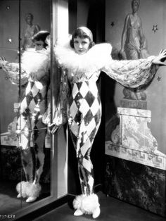 an old black and white photo of two mannequins