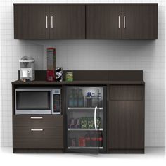 a microwave, refrigerator and coffee maker in a room with white tile flooring on the walls