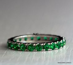 Gorgeous Natural Emerald Full Eternity Band. The Stones Are Set Into 925 Sterling Silver, 14k Rose Gold Filled & 14k Yellow Gold Filled. These Are Beautiful Emerald Stones Made By Me. This Is Handmade Ring.  PRODUCT DESCRIPTION  Product Name:------------- Natural Emerald Eternity Band Stone Name:--------------- Lab Created Emerald Stone Size:----------------- 3.00 MM. Main Stone:---------------- Emerald Material:------------------- 925 Sterling Silver, 14k Rose Gold Filled & 14k Yellow Gold Filled Sku:------------------------ A 12 If you want it's certificate, You need to pay 10$ Extra. NAAZ JEWELLERS CO. is a INDIAN SHOP. Our first priority is buyer satisfaction. If You get any type of fault in the product then before take any action, Please contact with us. You can contact with us any ti Green Emerald Cut Eternity Band, Green Gemstone Eternity Band For Promise, Classic Green Eternity Band, Emerald Eternity Ring Silver, Green Eternity Band For Anniversary, May Birthstone, Emerald Eternity Band, Promise Band, Emerald Gem, Lab Created Emerald