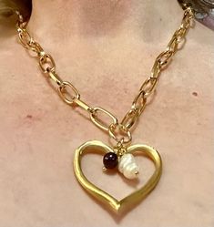 This is a 21 inch Large Heart Necklace. Golden Stainless Steel large  Paperclip Chain. The heart is very pretty and has a Garnet and a White Baroque Pearl on the inside of the heart. An awesome Valentines, Birthday or  Anniversary gift. Heart-shaped Metal Chain Necklace For Anniversary, Elegant Open Heart Necklace With Chain, Metal Heart Necklace With Open Heart Charm, Heart-shaped Chain Necklace For Anniversary, Heart-shaped Beads Chain Necklace Gift, Heart Beads Chain Necklace Gift, Open Heart Chain Necklace Gift, Valentine's Day Heart Beads Chain Necklace, Valentine's Day Double Heart Chain Necklace