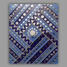 an artistic blue and silver tile design