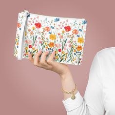 This Clutch Bag Flower Gift Bag makes a beautiful Birthday Present Clutch. It's perfect as a Summer clutch bag, Vacation bag, Floral Summer Beach Wedding Purse, and Clutch wallet. DETAILS .: Material: 100% PU faux leather  .: One size: 9.5" x 6.6" (24 x 17 cm) .: Wrist strap .: Saffiano pattern finish .: Two compartments - small pocket inside .: Black lining HOW TO ORDER 1. Select Quantity 2. Select Color (If Available in Different Colors) 3. Add to Cart SHIPPING Ships Within in 2-7 business day Gift Rectangular Clutch With Card Slots, Envelope Bags With Card Slots For Gift, White Rectangular Pouch For Gifts, White Envelope Bag For Gift, White Rectangular Pouch As Gift, White Rectangular Clutch For Gifts, White Rectangular Cosmetic Bag As Gift, White Rectangular Cosmetic Bag For Gift, White Rectangular Case Clutch As Gift