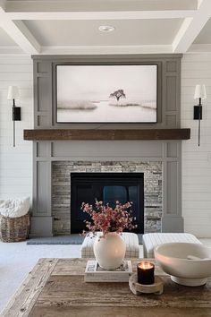 the living room is clean and ready for us to use it's fireplace as a focal point