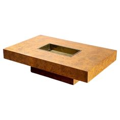 a square wooden table with a hole in the middle