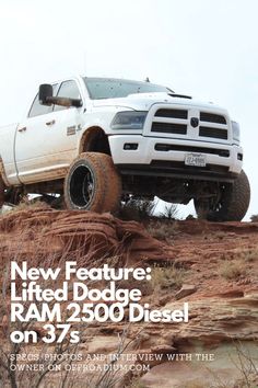 a white ram truck driving on top of a dirt hill with the words new feature lifted dodge ram 350 diesel on 37s