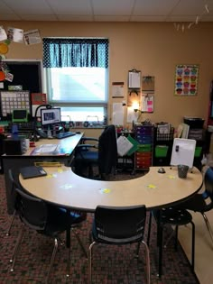 a classroom with desks and chairs in front of a window