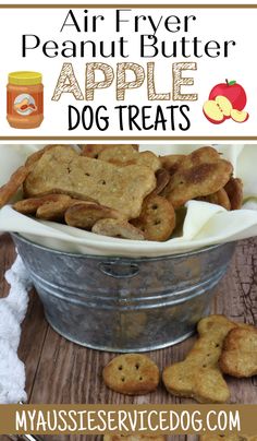 an air fryer with apple dog treats in it and the words, air fryer peanut butter apple dog treats