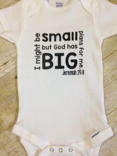 a white bodysuit with the words small, but god has big written on it