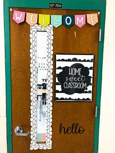 a classroom door decorated with welcome signs and decorations