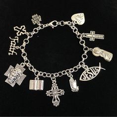 New. This Bracelet Makes A Perfect Gift Has 11 Religious Christian Themed Charms Stainless Steel Bracelet Has A Lobster Clasp Closure Measures Approx 8” Bracelet And Charms Are Silver Tone Alloy And Steel. Charms Include Jesus Loves You, Cross, Faith, Jesus Face On Cross, Bible, Cross, Praying Hands, Jesus Fish, Mother Mary Holding Baby Jesus, Trust God Cross, I Love God Heart God Bracelet, Bible Cross, God Cross, I Love God, Graduation 2024, God's Heart, Jesus Face, Praying Hands, Holding Baby