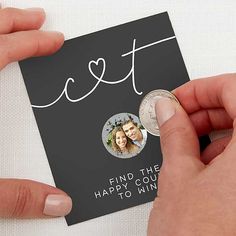 two hands holding a card with the words lett and a coin in front of it