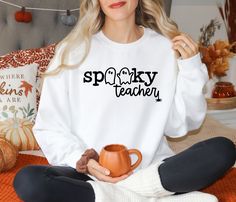 The kids will love their teachers wearing this crewneck for Halloween!  Get the whole teaching team to participate! Choose between a smooth design or a puffy design. White Sweatshirt For Teacher Appreciation In Fall, Wrestling Mom Shirts, Band Mom Shirts, Girl Mom Shirt, Dance Mom Shirts, Basketball Mom Shirts, Volleyball Mom Shirts, Kids Birthday Shirts, Cheer Mom Shirts