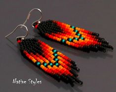 two pairs of beaded earrings with black and orange beads