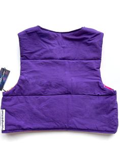 Upcycled mini cropped patchwork quilted vest with snap buttons. Made from secondhand bandanas and sheets. Metal snap buttons. Reversible! Bandana patchwork side one, basic statement purple side 2. Filled with polyester insulation for a lightweight puffer. Size small. Fits up to 34” bust. 17” long. Mini Patchwork, Quilted Puffer Vest, Quilted Vest, Patchwork Quilt, Puffer Vest, Bandanas, Patchwork Quilts, Insulation, Puffer