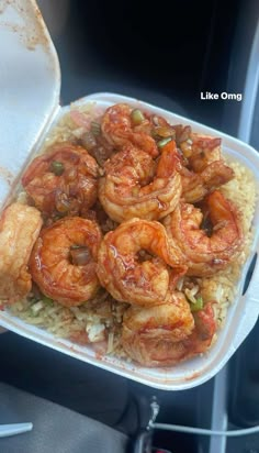 a plastic container filled with shrimp and rice