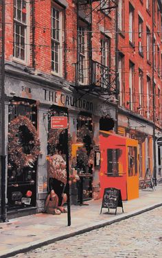 a painting of people sitting on the sidewalk in front of an orange and black building