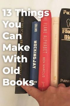 a hand holding three books with the title 13 things you can make with old books