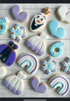 frozen princess cookies are arranged on a table