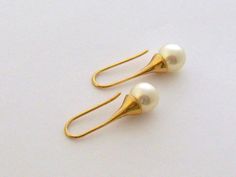 "Drop Pearl Earrings/Gold and 10 mm Cream Drop Pearl Earrings/Sweet 16/Large Pearl Earrings/Angelina Jolie Wedding Jewelry/Bridesmaid Gift These are earrings that you'll wear for years to come. Lovely cream Swarovski crystal pearl hangs below from a gold plated lever back ear wire. Elegant, classical jewelry that easily dresses up or down, these earrings will become a staple in your wardrobe. Size: 10 mm pearl Shown ** 8 mm also available Length: 1.35 inch, Drop 1 inch Available in gold plate or Wedding Earrings With French Hook In Round Shape, Wedding Earrings With French Hook, French Hook Wedding Earrings, Wedding French Hook Round Earrings, Angelina Jolie Wedding, Classical Jewelry, Drop Pearl Earrings, Large Pearl Earrings, Pearl Earrings Gold