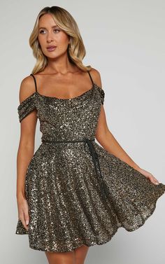 Get ready to turn heads at your next party night with the Keke Mini Dress! This playful and flirty dress features a strappy off-shoulder design and a sexy cowl neck that will make you feel like the life of the party. The A-line silhouette adds a touch of femininity, while the shimmering gold color adds an extra dash of glam. Made from polyester, this sleeveless mini dress is not only stylish but also comfortable to wear all night long. Perfect for dancing the night away or making a statement at Basic Black Dress, Bachelorette Dress, Neon Outfits, Spring Maxi Dress, Flirty Dresses, Long Sleeve Knit Dress, Life Of The Party, Strapless Tops, Shoulder Design