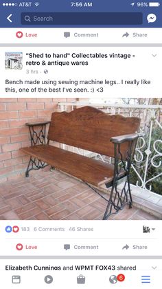 a wooden bench sitting on top of a brick floor next to a fence and window