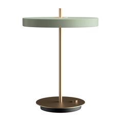 an orange table lamp sitting on top of a metal stand