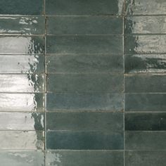 a tile wall that has water on it