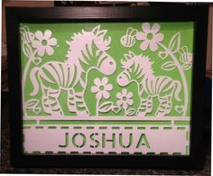 a green and white sign with zebras in the background that says joshua on it