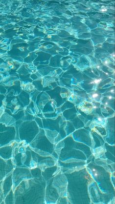 the water is very clear and blue with little ripples on it's surface