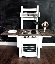 a white chair sitting next to a stove top oven